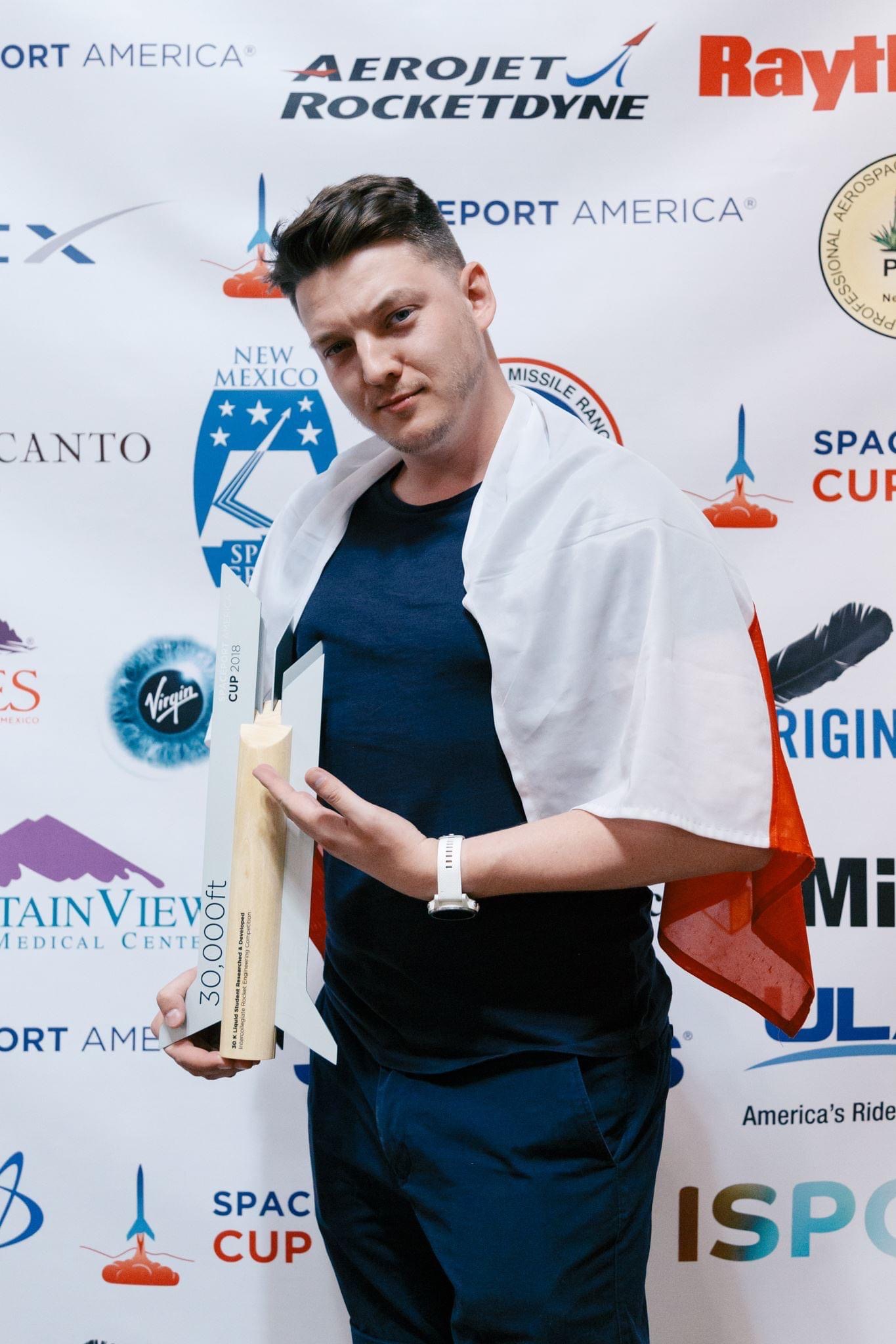 Piotr Wolanski with a Spaceport America Cup rocket trophy, AGH Space Systems